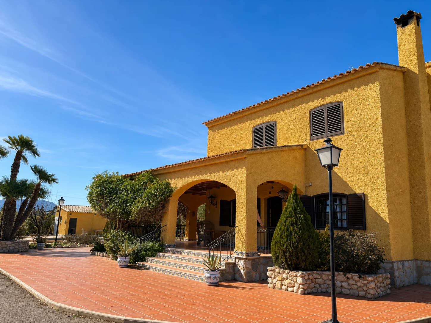 Mediterranean exterior of the UTC Spain villa with tiled terrace