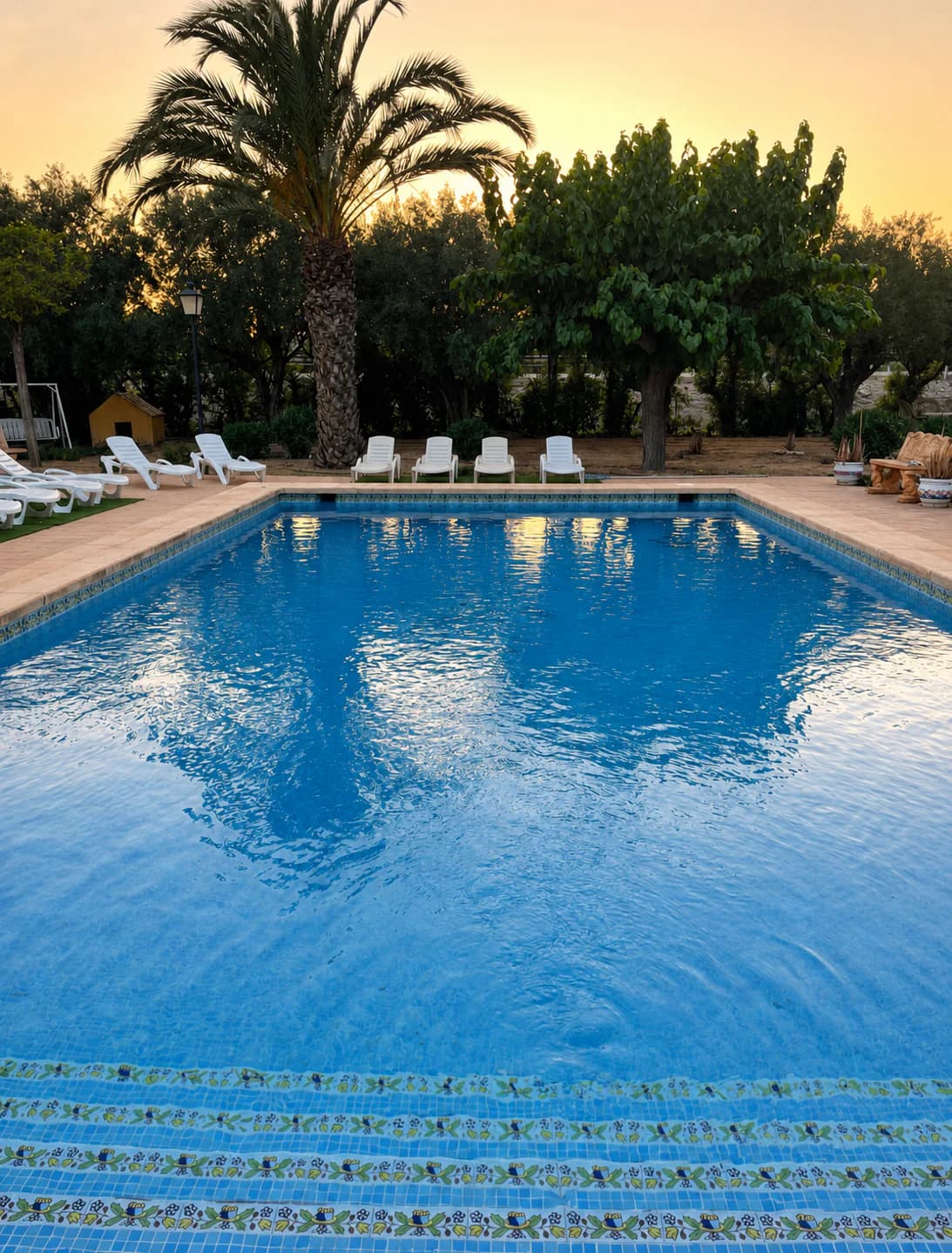 Private swimming pool at the UTC Spain villa at sunset